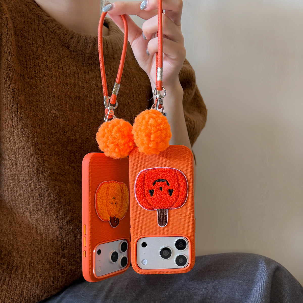 Orange Fabric Phone Case with Plush Embroidered Pumpkin & Pom-Pom Bell Wrist Strap