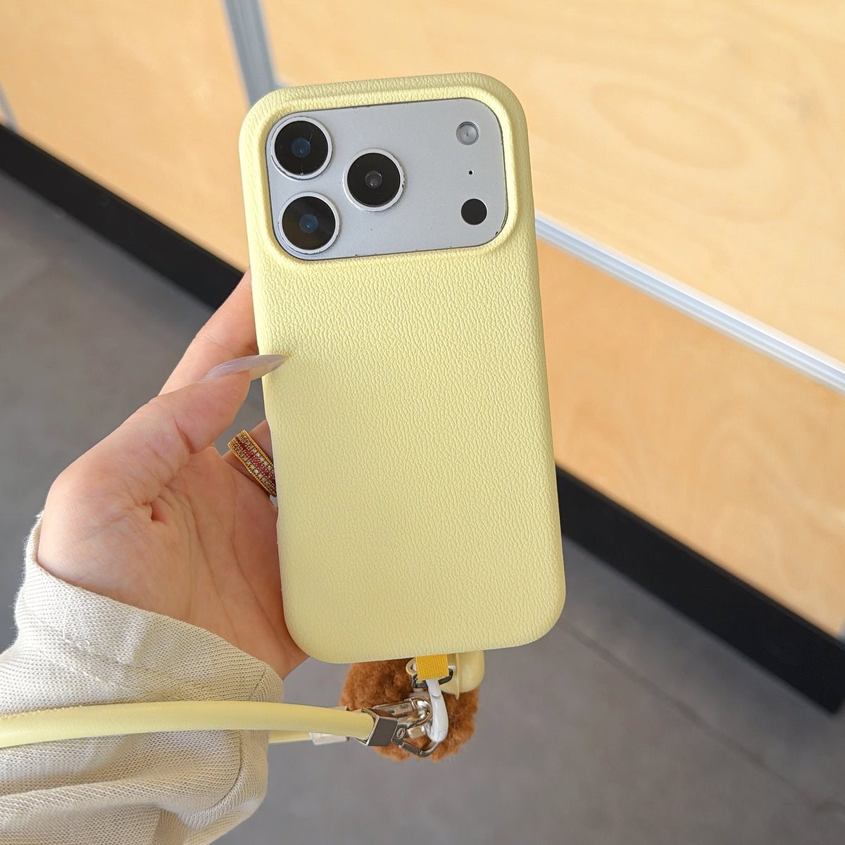 Solid Color Bell Wrist Strap Phone Case