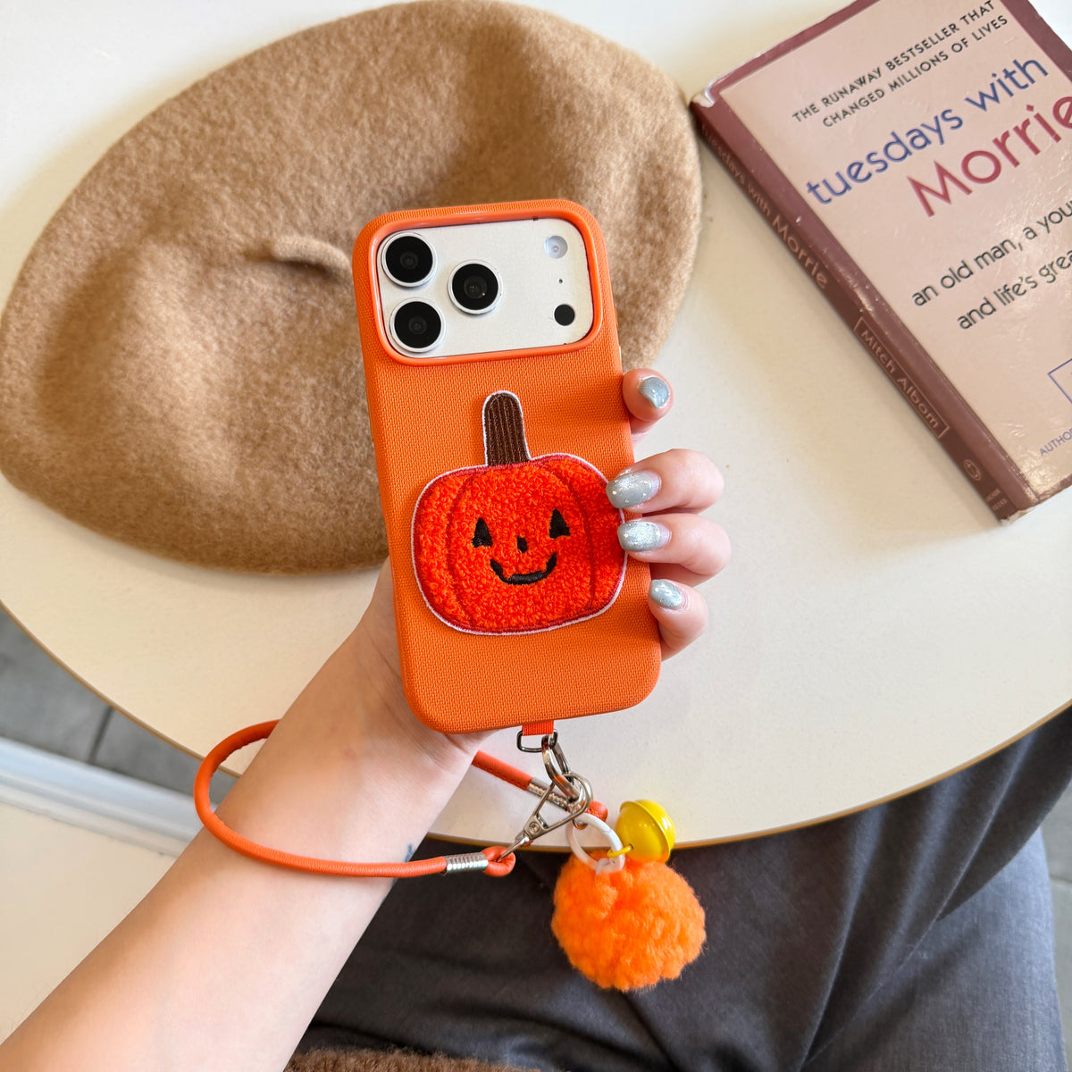 Orange Fabric Phone Case with Plush Embroidered Pumpkin & Pom-Pom Bell Wrist Strap